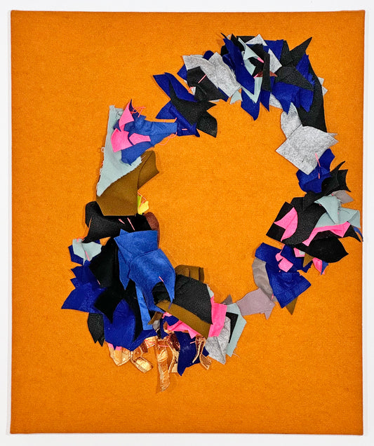 a textile collage on an orange piece of fabric which has been stretched over a panel. Small pieces of blue, silver, black, and pink fabric are stitched together in a wreath form on top of the orange fabric. 