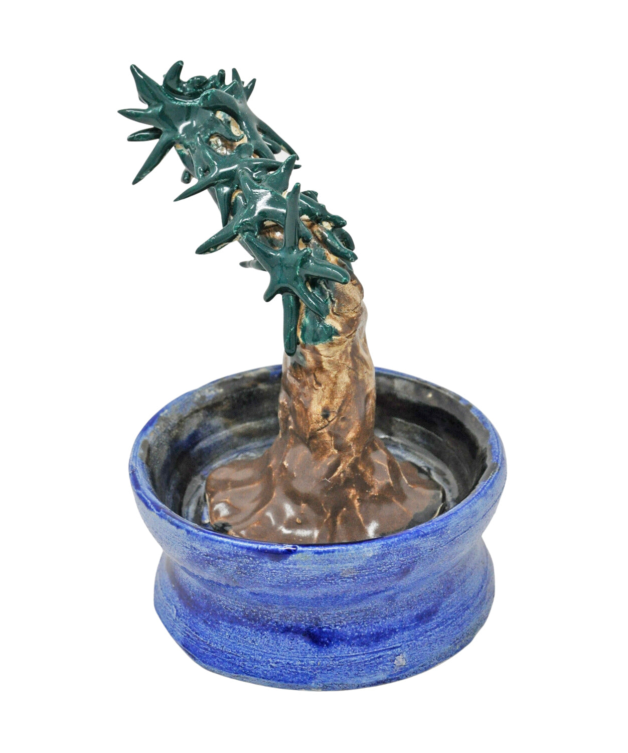 A ceramic sculpture of a prickly cactus.